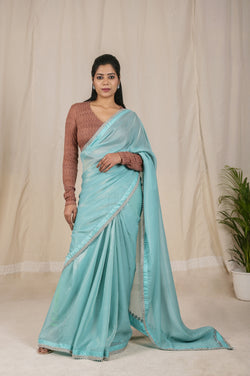 Beautiful Shimmer Net Saree in Sky Blue, adorned with a Golden Shine and a Stunning Silver dori border