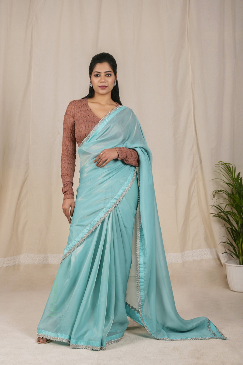 Beautiful Shimmer Net Saree in Sky Blue, adorned with a Golden Shine and a Stunning Silver dori border