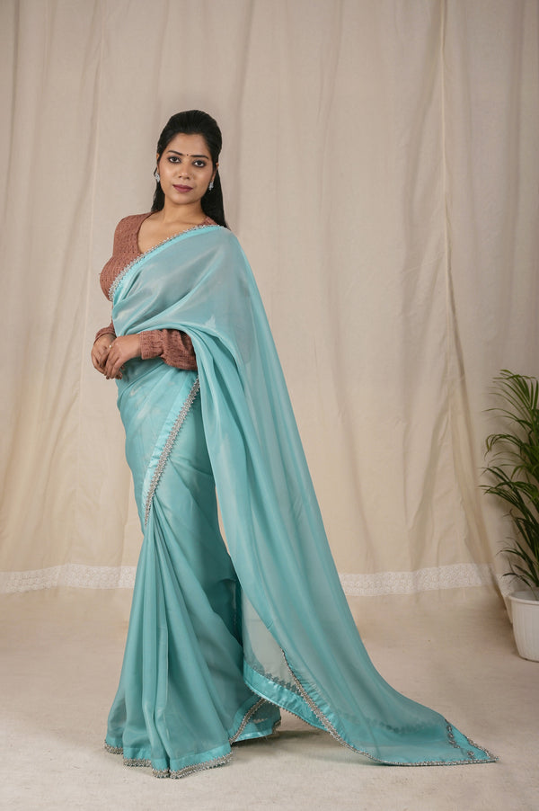 Beautiful Shimmer Net Saree in Sky Blue, adorned with a Golden Shine and a Stunning Silver dori border