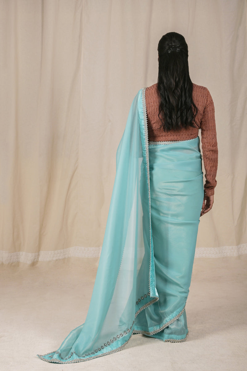 Beautiful Shimmer Net Saree in Sky Blue, adorned with a Golden Shine and a Stunning Silver dori border